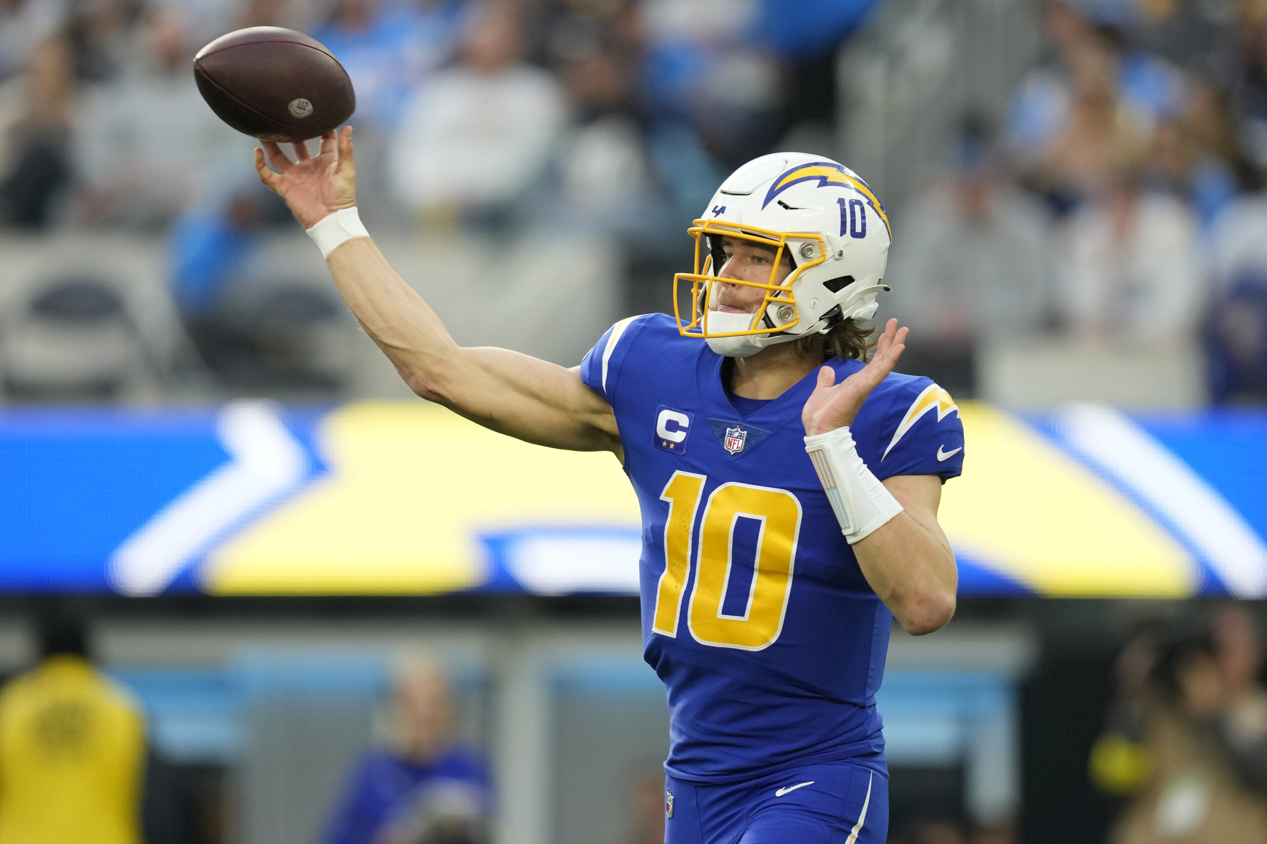 Los Angeles Chargers quarterback Justin Herbert (10) passes against the Tennessee Titans during the first half of an NFL football game in Inglewood, Calif., Sunday, Dec. 18, 2022. (AP Photo/Ashley Landis)