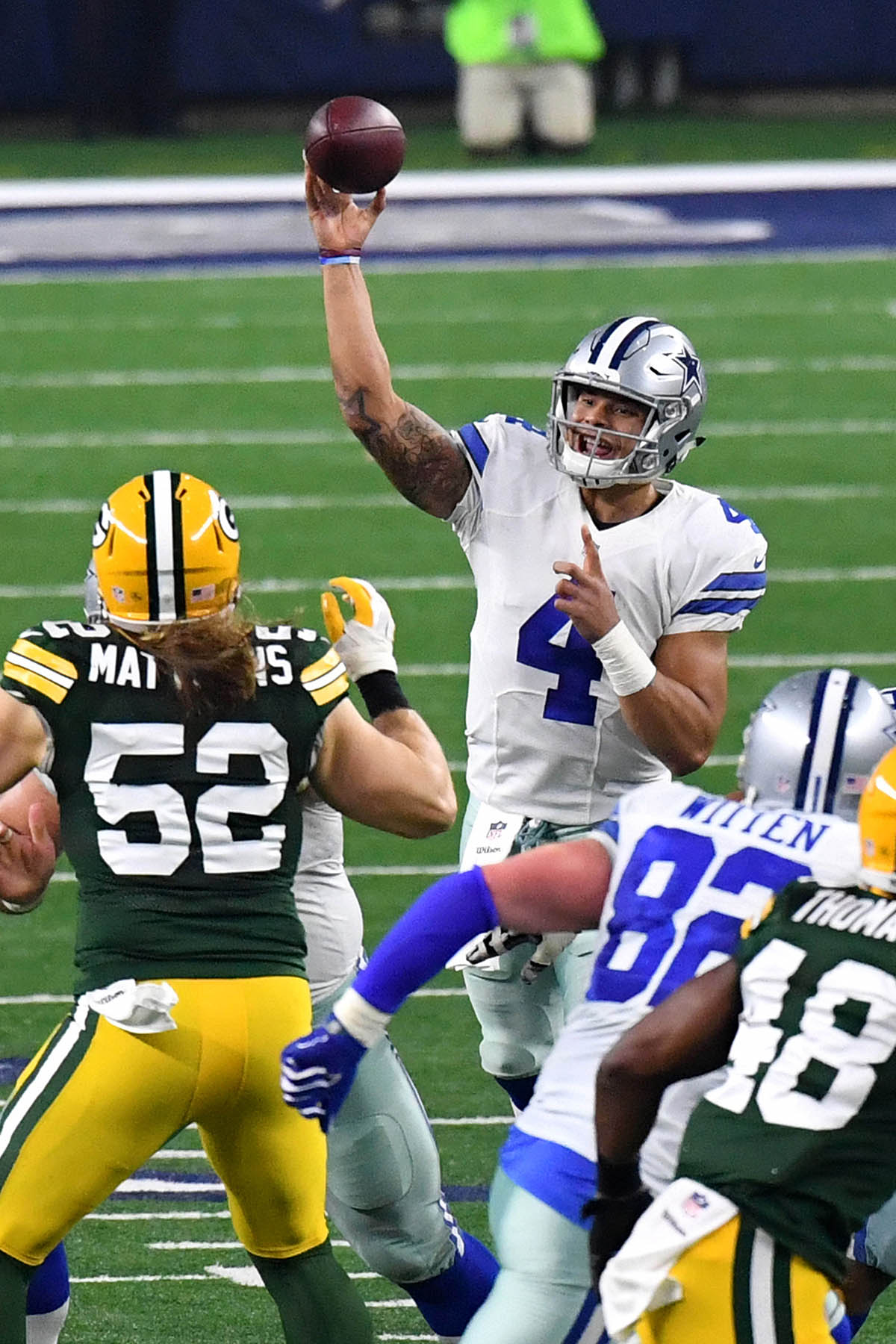 Dallas Cowboys quarteback, DAK PRESCOTT, completes a pass to wide receiver Cole Beasley at the end of the first half of the NFC Championship game at A&T Stadium.  Prescott completed 24 of 38 passes for 302 yards and 3 touchdowns and 1 interception in a 34-31 losing effort.