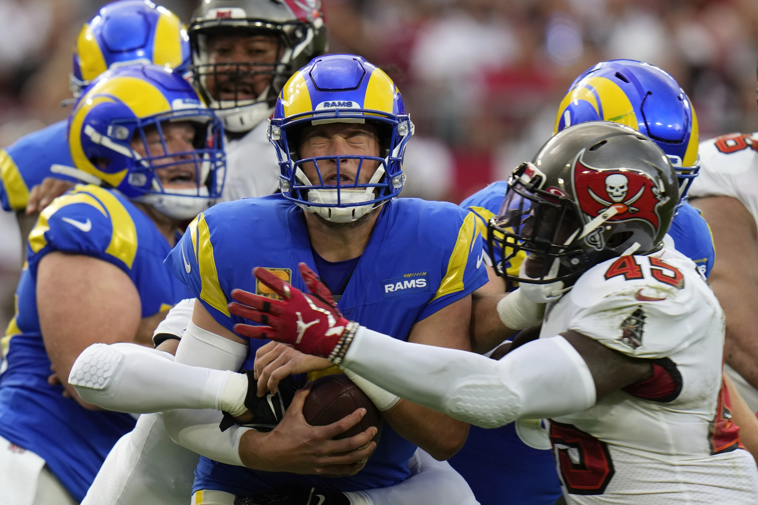 Los Angeles Rams quarterback Matthew Stafford (9) is sacked by Tampa Bay Buccaneers linebacker Devin White (45) during the first half of an NFL football game between the Los Angeles Rams and Tampa Bay Buccaneers, Sunday, Nov. 6, 2022, in Tampa, Fla. (AP Photo/Chris O'Meara)